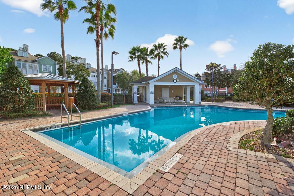 8550 Touchton Road, Unit 2221 Jacksonville, FL 32216 - Photo 45 of 53 a view of a house with pool and chairs