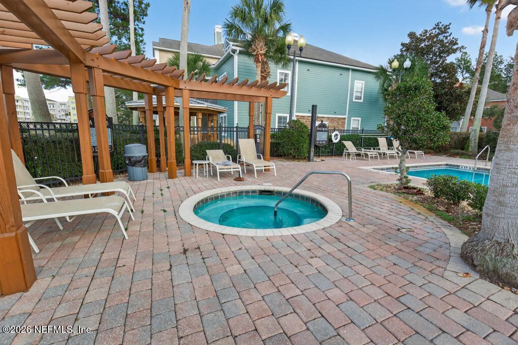 8550 Touchton Road, Unit 2221 Jacksonville, FL 32216 - Photo 48 of 53 a view of a swimming pool with a patio
