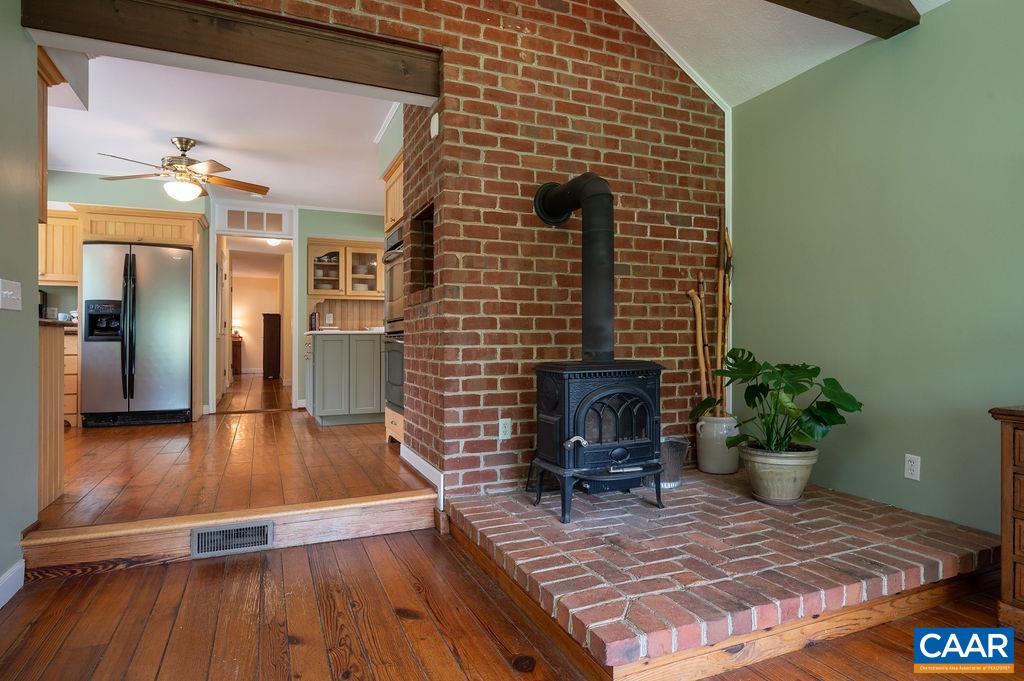 2903 Pea Ridge Road Charlottesville, VA 22901 - Photo 12 of 37 a living room with a rug and wooden floor