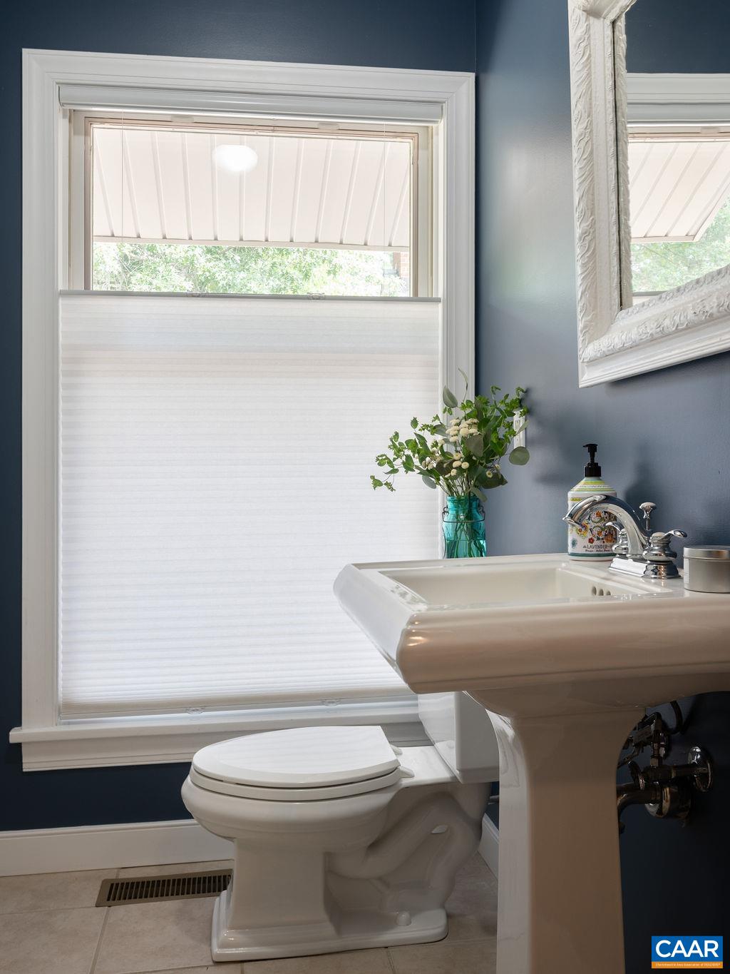 2903 Pea Ridge Road Charlottesville, VA 22901 - Photo 13 of 37 a bathroom with a toilet sink and mirror