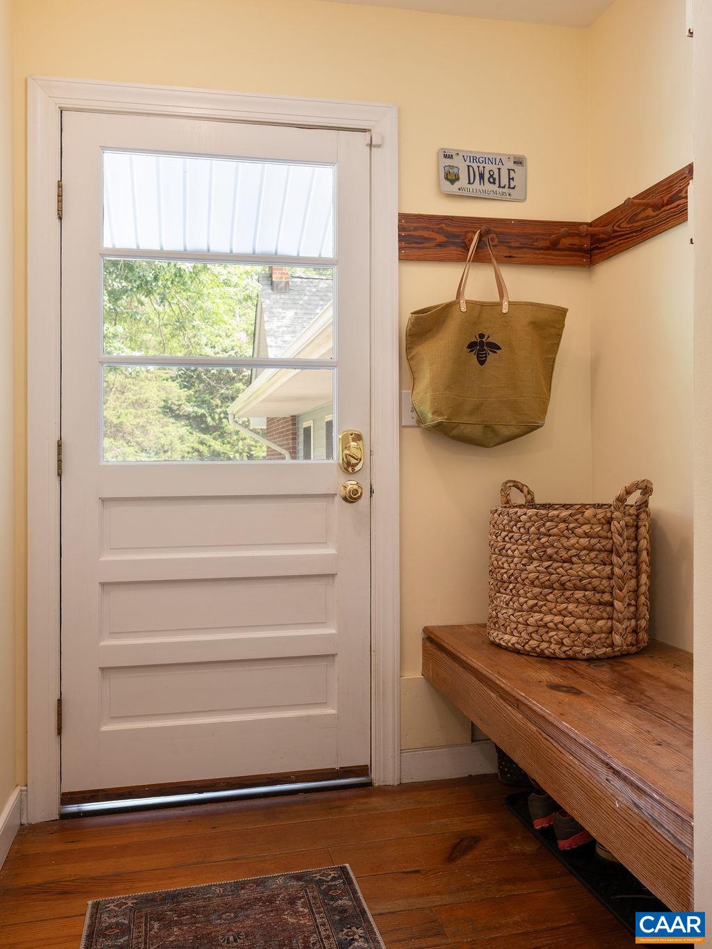 2903 Pea Ridge Road Charlottesville, VA 22901 - Photo 14 of 37 a bench sitting on top of a wooden floor