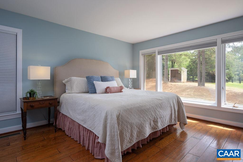 2903 Pea Ridge Road Charlottesville, VA 22901 - Photo 16 of 37 a bedroom with a bed and a large window