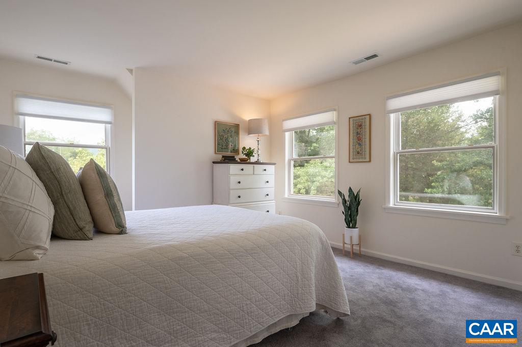 2903 Pea Ridge Road Charlottesville, VA 22901 - Photo 18 of 37 a bedroom with a bed and a window