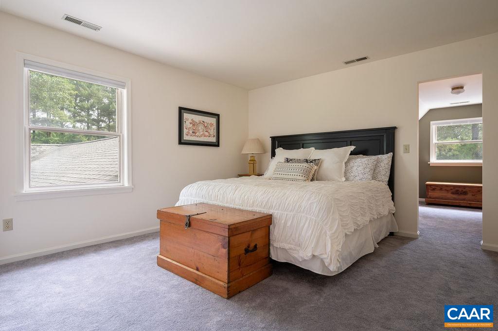 2903 Pea Ridge Road Charlottesville, VA 22901 - Photo 19 of 37 a spacious bedroom with a bed and window