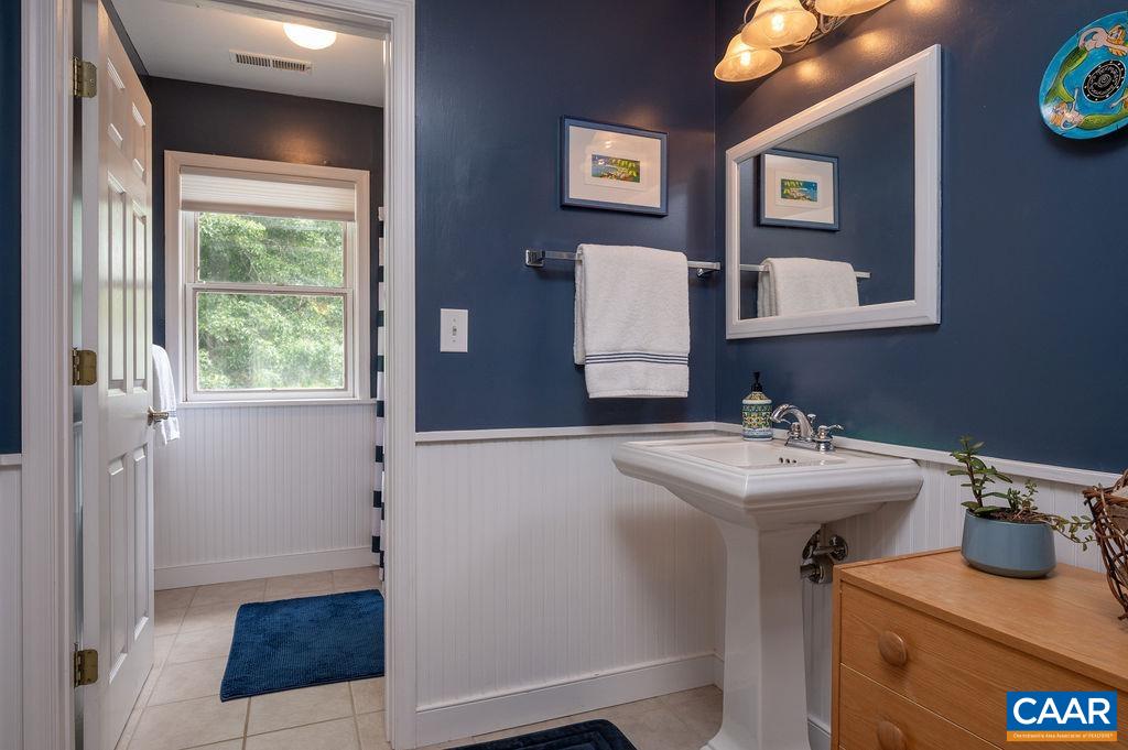 2903 Pea Ridge Road Charlottesville, VA 22901 - Photo 20 of 37 a bathroom with a sink and a mirror