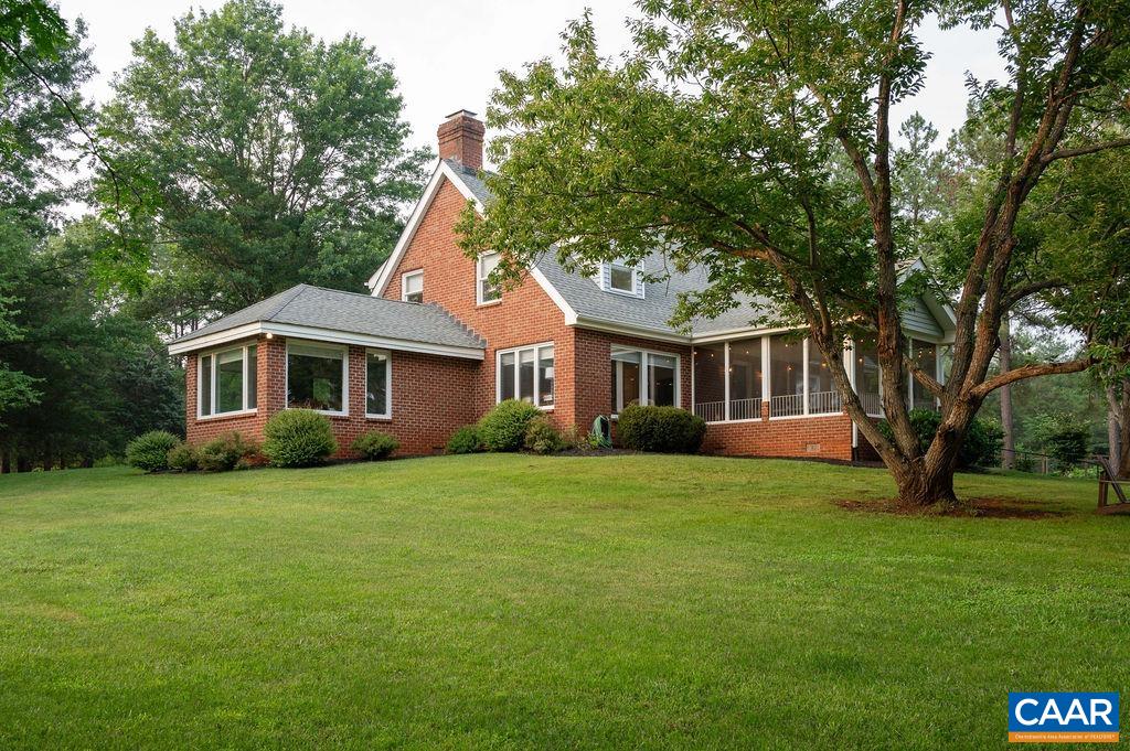 2903 Pea Ridge Road Charlottesville, VA 22901 - Photo 26 of 37 a front view of a house with a garden