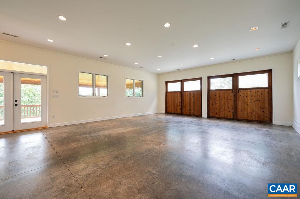 2903 Pea Ridge Road Charlottesville, VA 22901 - Photo 32 of 37 a view of an empty room with a window and a kitchen