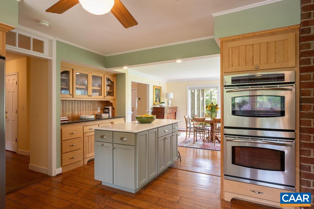 2903 Pea Ridge Road Charlottesville, VA 22901 - Photo 9 of 37 a kitchen with stainless steel appliances a stove microwave and cabinets