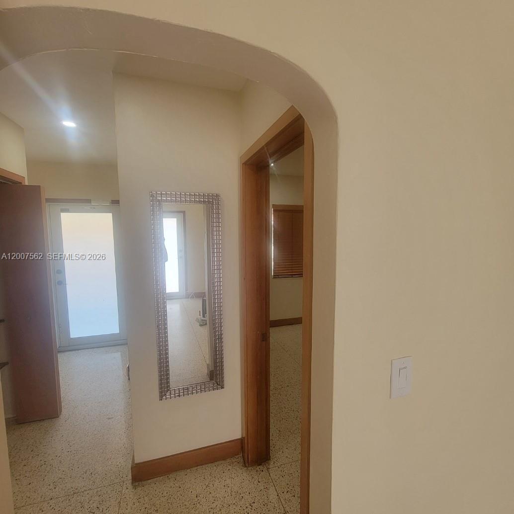 7400 Harding Avenue, Unit 15 Miami Beach, FL 33141 - Photo 13 of 26 a view of a hallway with front door