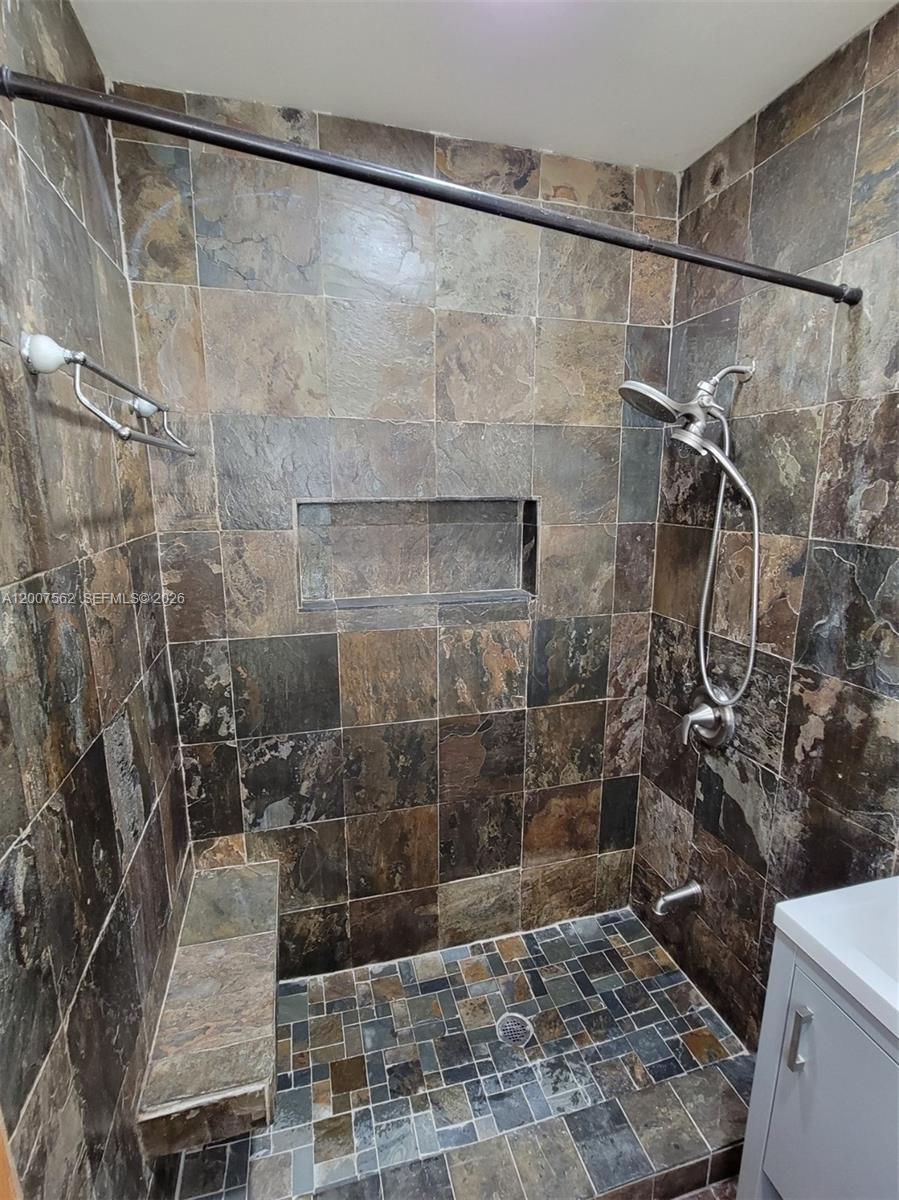 7400 Harding Avenue, Unit 15 Miami Beach, FL 33141 - Photo 21 of 26 a bathroom with a shower
