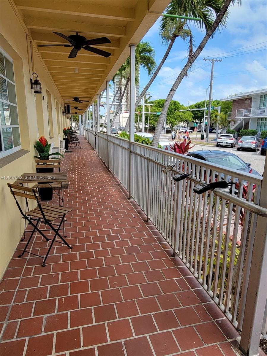 7400 Harding Avenue, Unit 15 Miami Beach, FL 33141 - Photo 22 of 26 a view of a chairs and table in the balcony