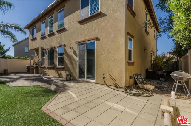 a house view with a backyard space