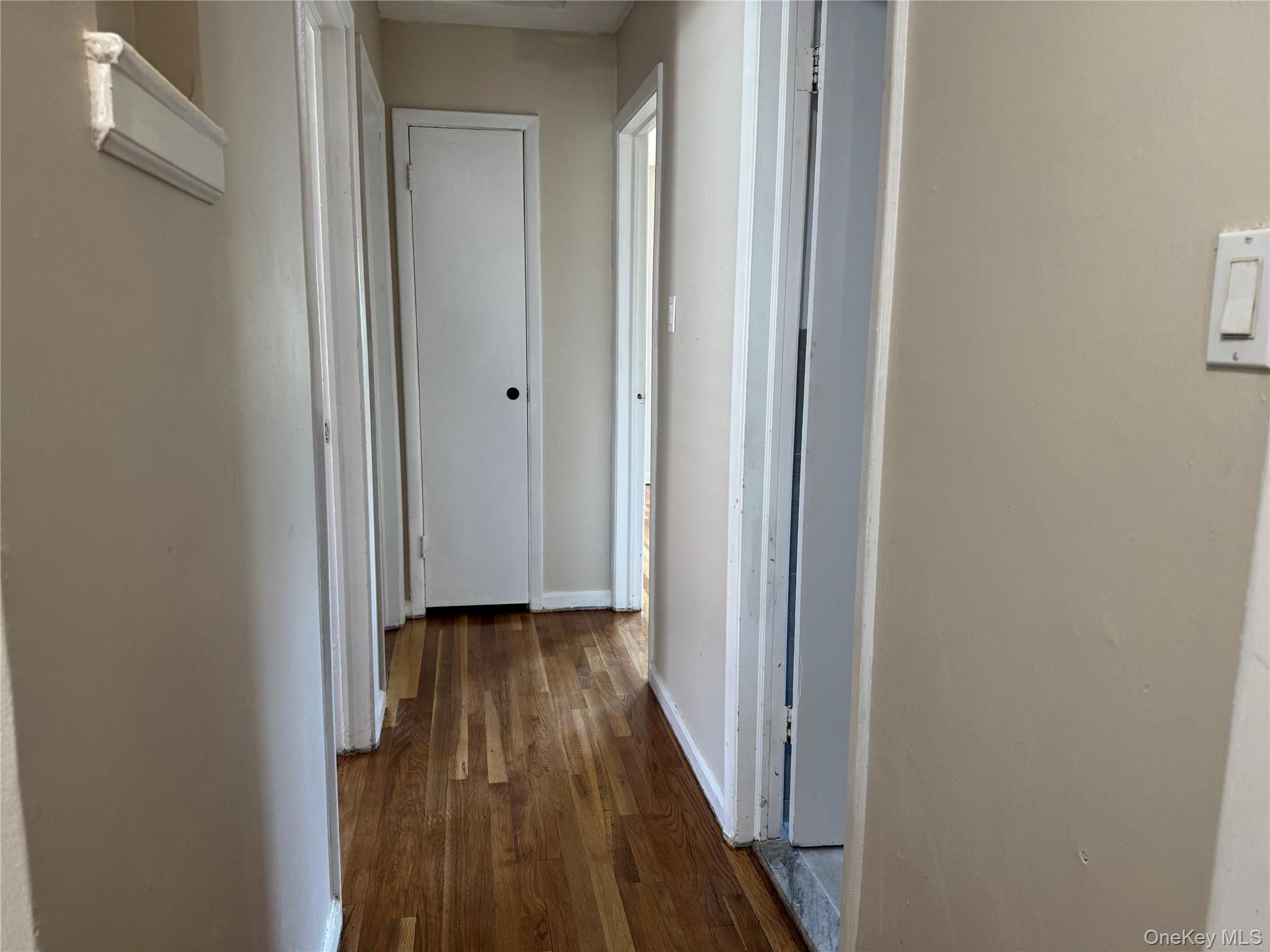 375 Cochran Place, Unit 2 Valley Stream, NY 11581 - Photo 7 of 12 a view of a hallway with wooden floor