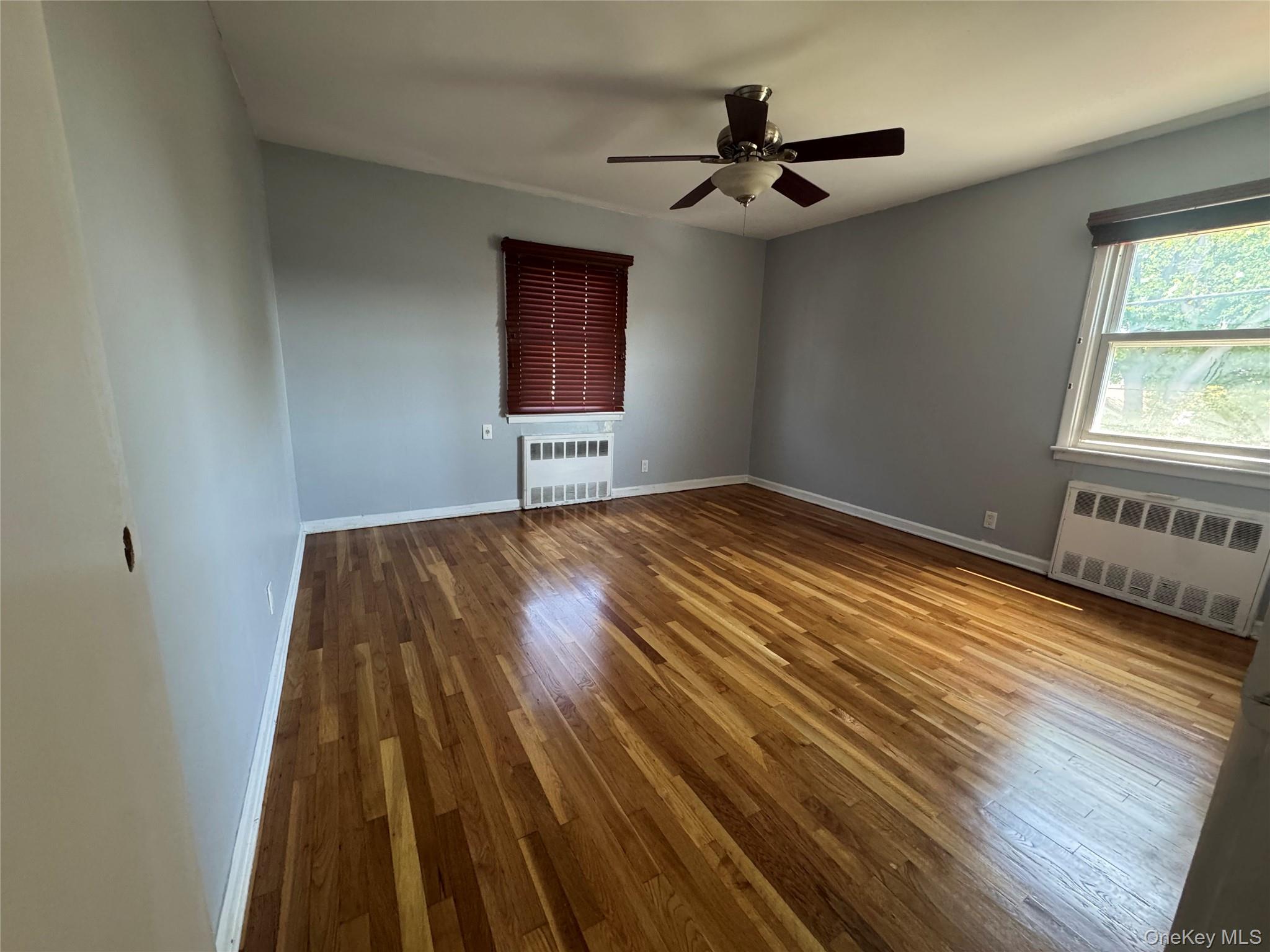 375 Cochran Place, Unit 2 Valley Stream, NY 11581 - Photo 9 of 12 a view of a livingroom with a hall and wooden floor