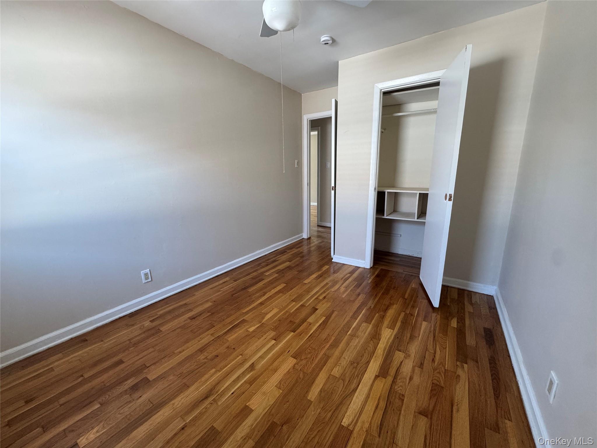 375 Cochran Place, Unit 2 Valley Stream, NY 11581 - Photo 10 of 12 a view of a room with wooden floor and bench