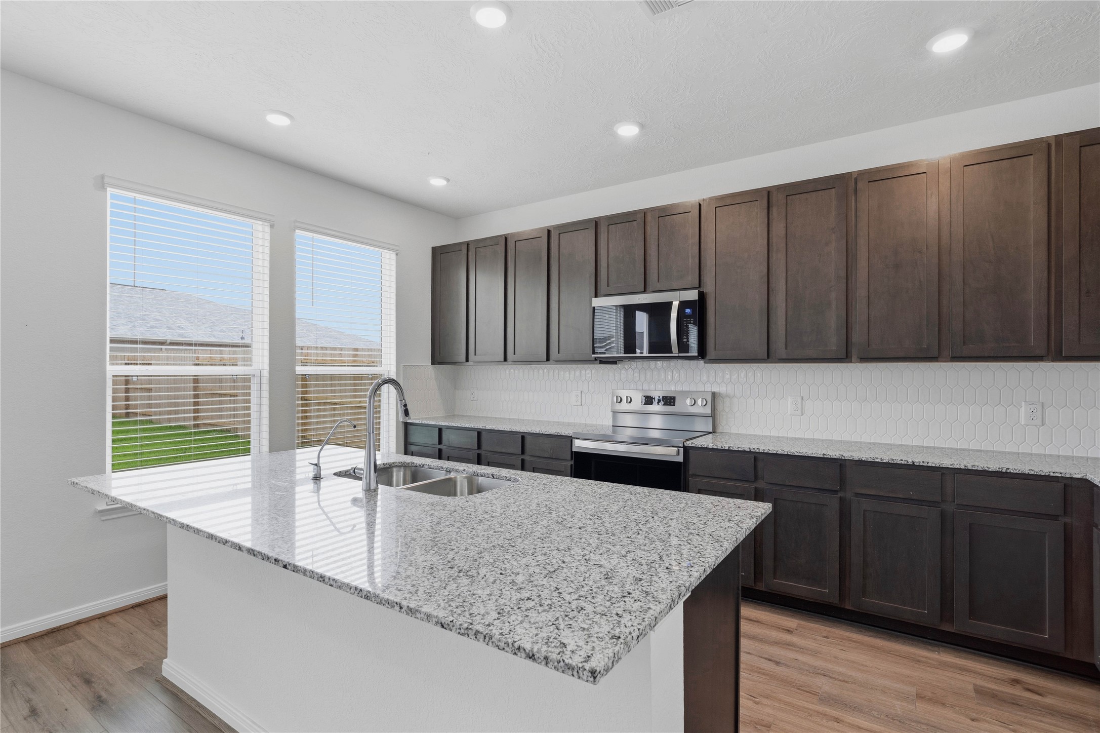 2503 Spruce Hl Road Beasley, TX 77417 - Photo 14 of 31 Convenient breakfast bar addition, perfect for casual dining and entertaining.