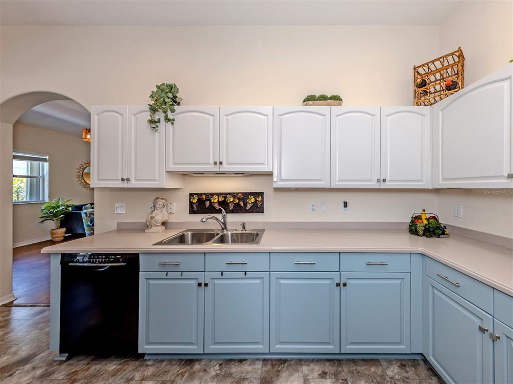 205 Reclinata Circle Venice, FL 34292 - Photo 17 of 62 a kitchen with stainless steel appliances granite countertop a sink a stove and cabinets