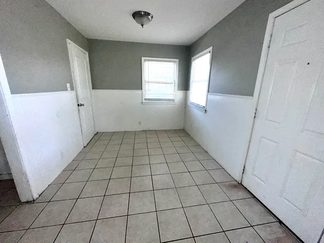 a view of an empty room and window