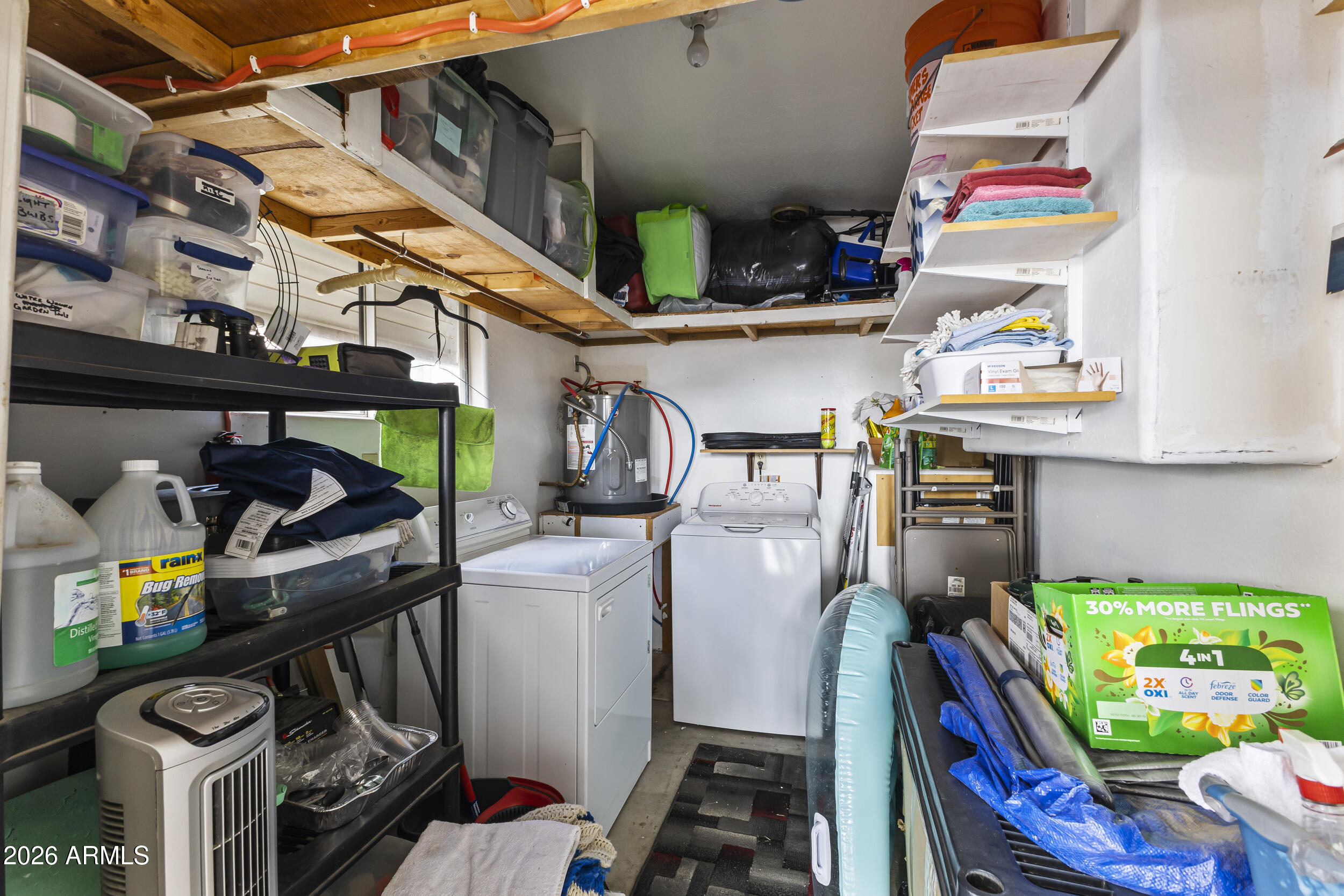 17200 West Bell Road, Unit 548 Surprise, AZ 85374 - Photo 18 of 19 a utility room with lots of clutter and cabinets