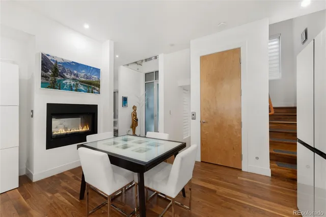 a kitchen with stainless steel appliances kitchen island granite countertop a stove and a refrigerator