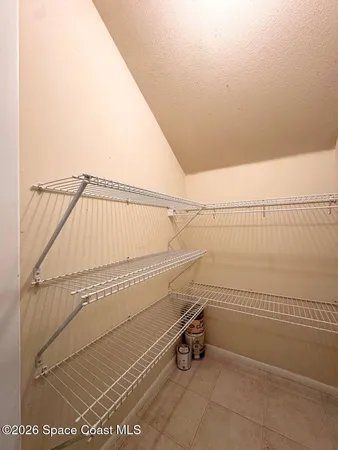 a view of a room with racks on the wall