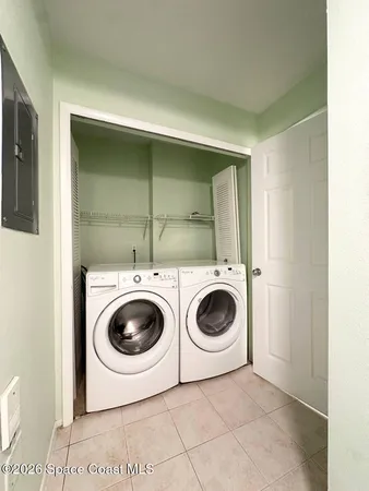 an empty room with a ceiling fan and a window