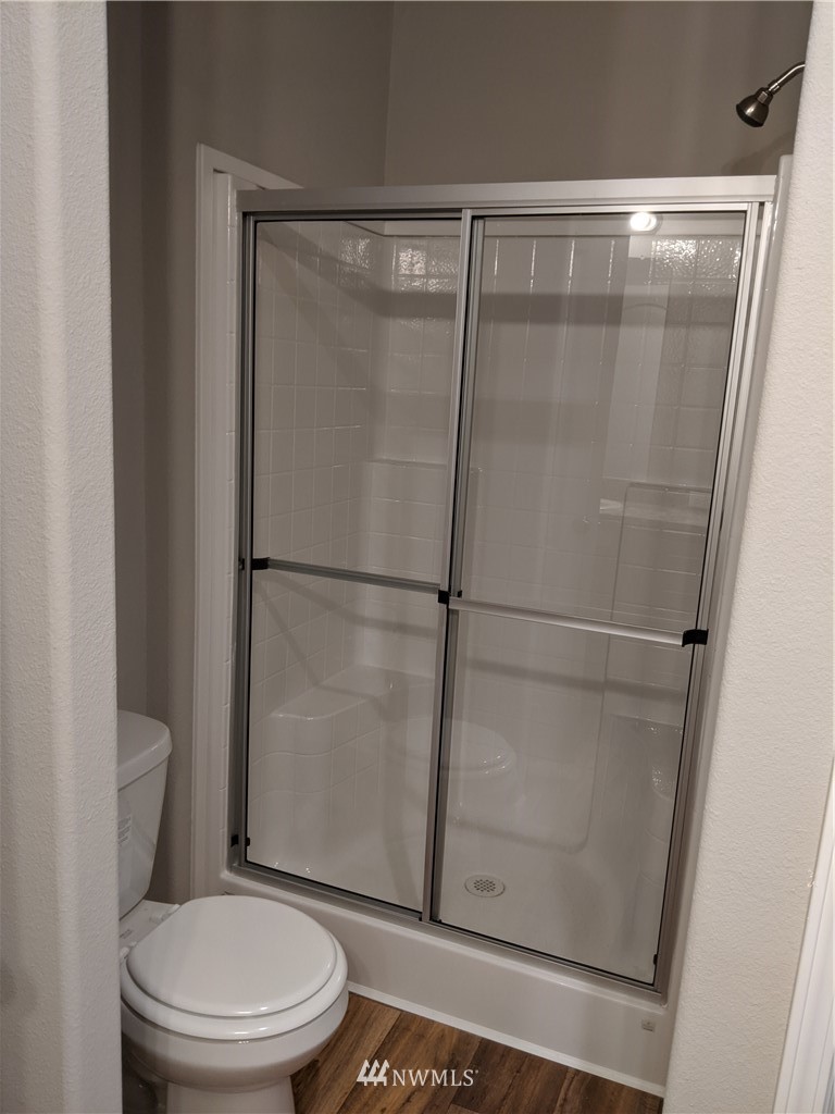 473 Harmon Road Chehalis, WA 98532 - Photo 14 of 15 a white toilet sitting next to a shower