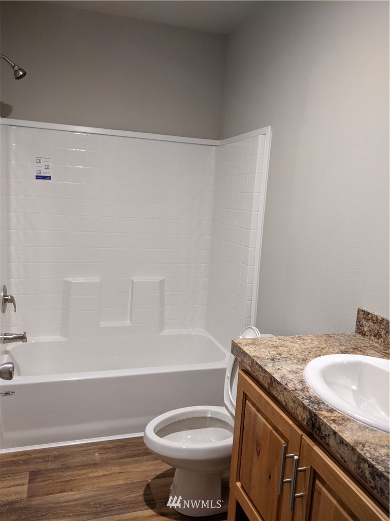 473 Harmon Road Chehalis, WA 98532 - Photo 15 of 15 a bathroom with a granite countertop sink toilet and shower