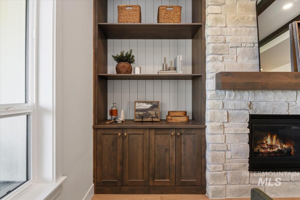 7615 Brown Way Eagle, ID 83714 - Photo 9 of 43 Built-in shelving unit featuring shaker-style cabinet doors and a shiplap backing
