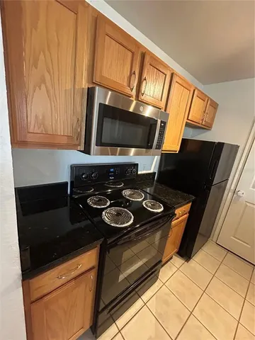 a kitchen with a stove and a microwave