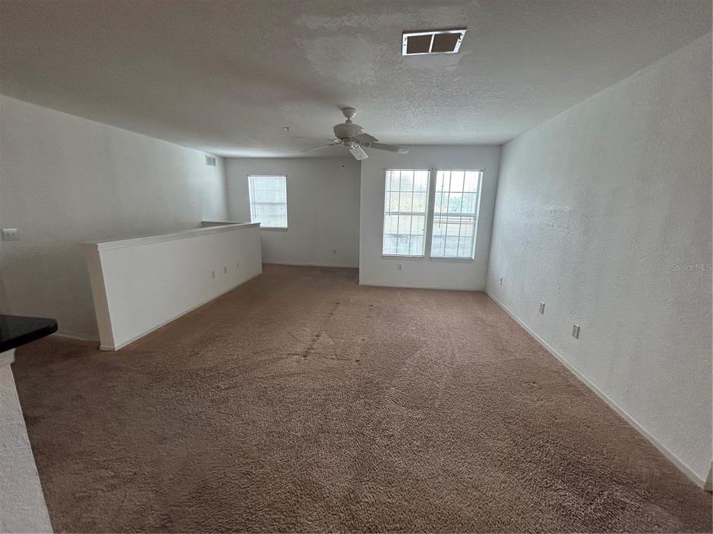 4850 51st Street West, Unit 8201 Bradenton, FL 34210 - Photo 6 of 14 en empty room with windows and closet