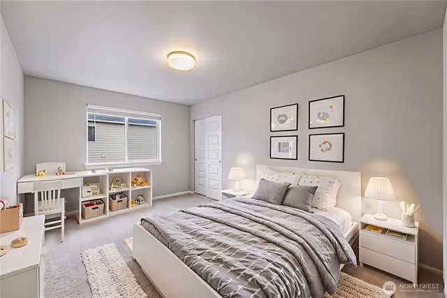 a bedroom with a large bed and a window