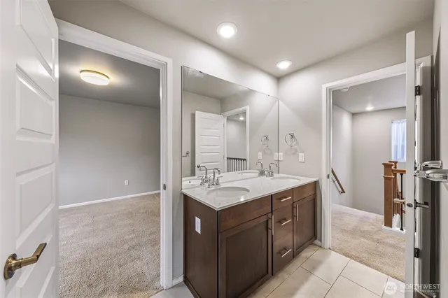 a bathroom with a sink a vanity and a mirror