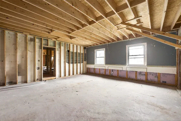 a view of an empty room with windows