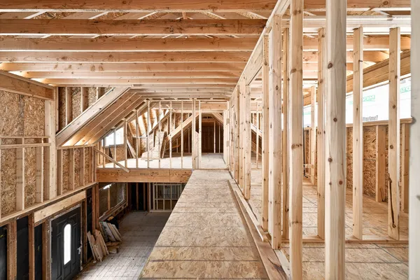 a view of balcony with wooden floor and seating