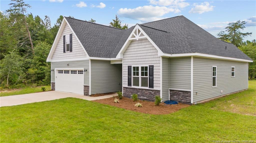 2902 Calloway (lot 1) Road Rockingham, NC 28379 - Photo 3 of 44 a view of a house with a yard