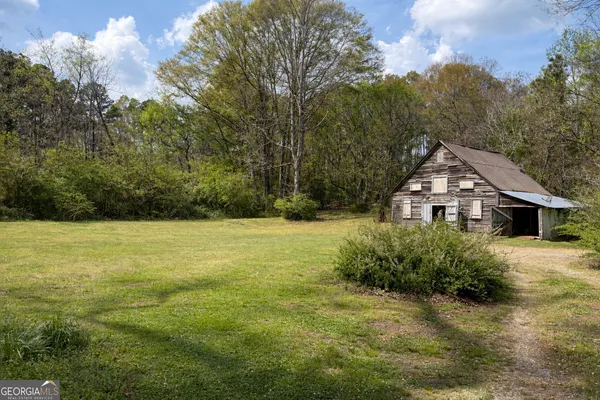 a view of a house with a big yard