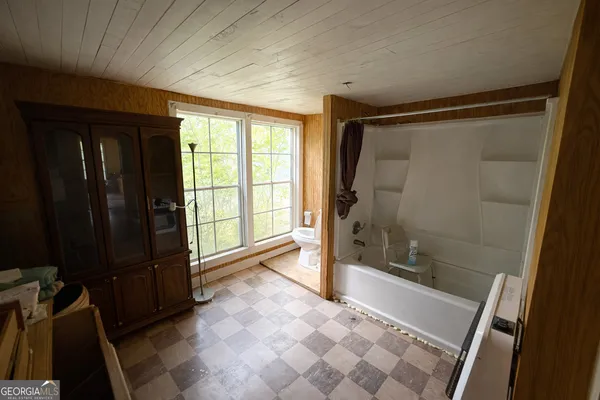 a bathroom with a glass shower door