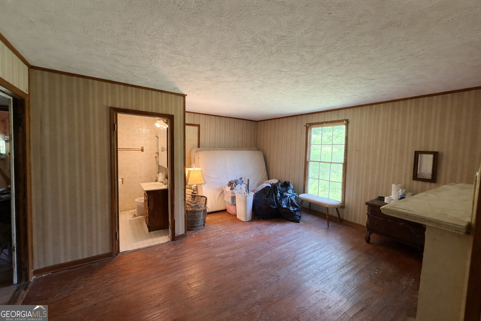 610 East Johnson Street Temple, GA 30179 - Photo 10 of 20 a living room with furniture and a window