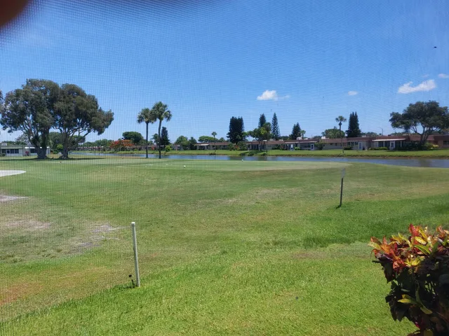 a view of a golf course with a lake