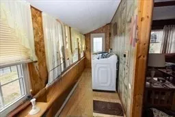 a bathroom with a toilet and a shower curtain