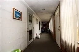 a dining room with furniture and a gym machine