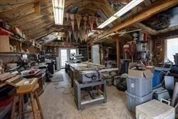 a view of backyard with a table and chairs