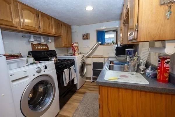 a bedroom with furniture and a large window