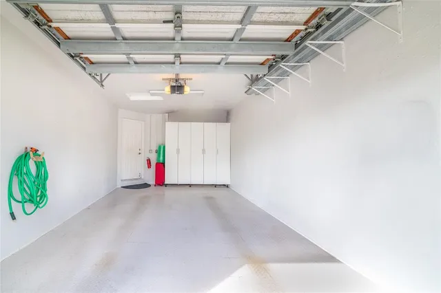 a view of house with garden and entertaining space