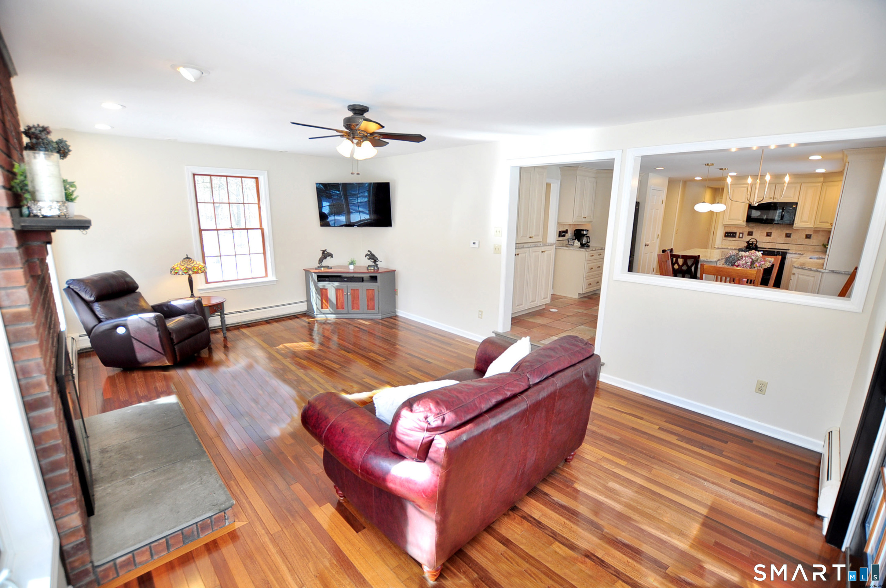 102 Petersen Road Granby, CT 06035 - Photo 12 of 40 a living room with furniture and wooden floor
