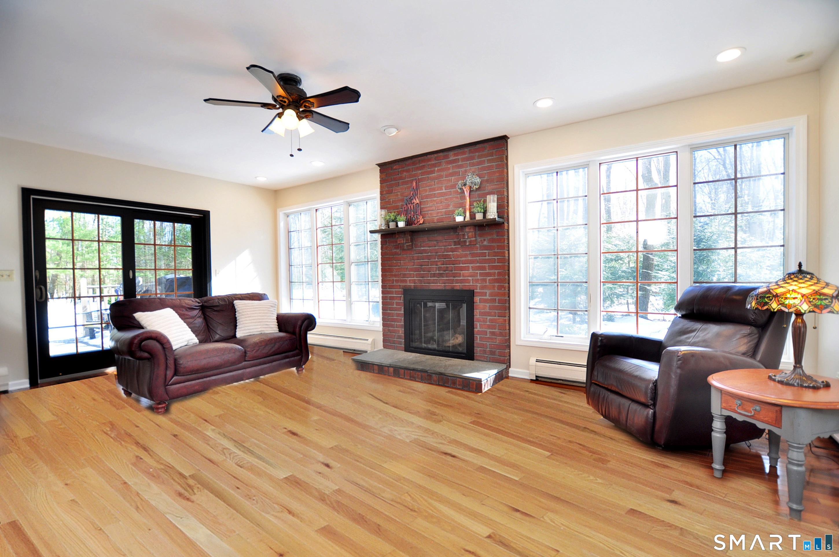 102 Petersen Road Granby, CT 06035 - Photo 13 of 40 a living room with furniture window and a fireplace