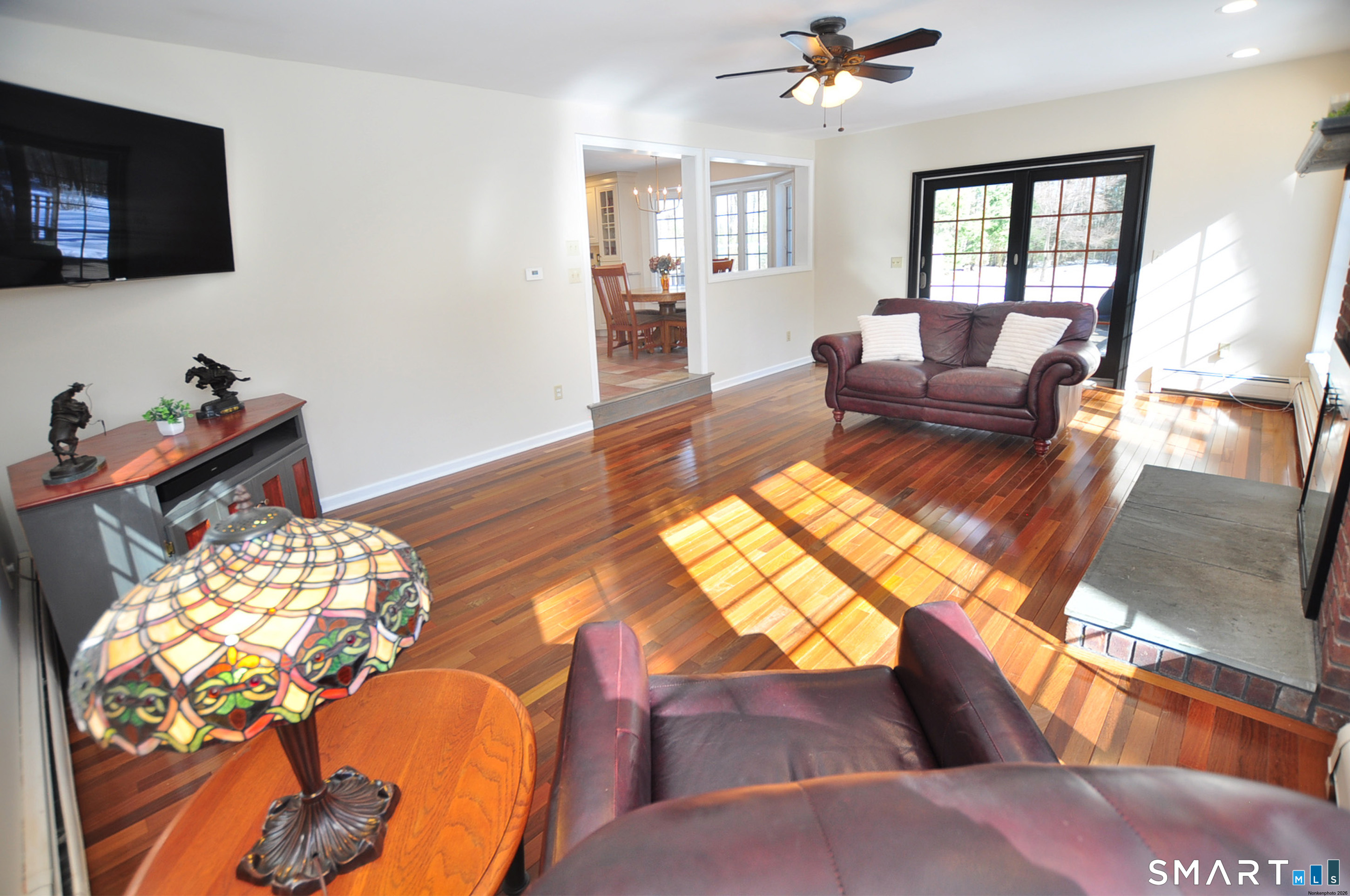 102 Petersen Road Granby, CT 06035 - Photo 14 of 40 a living room with furniture and a flat screen tv