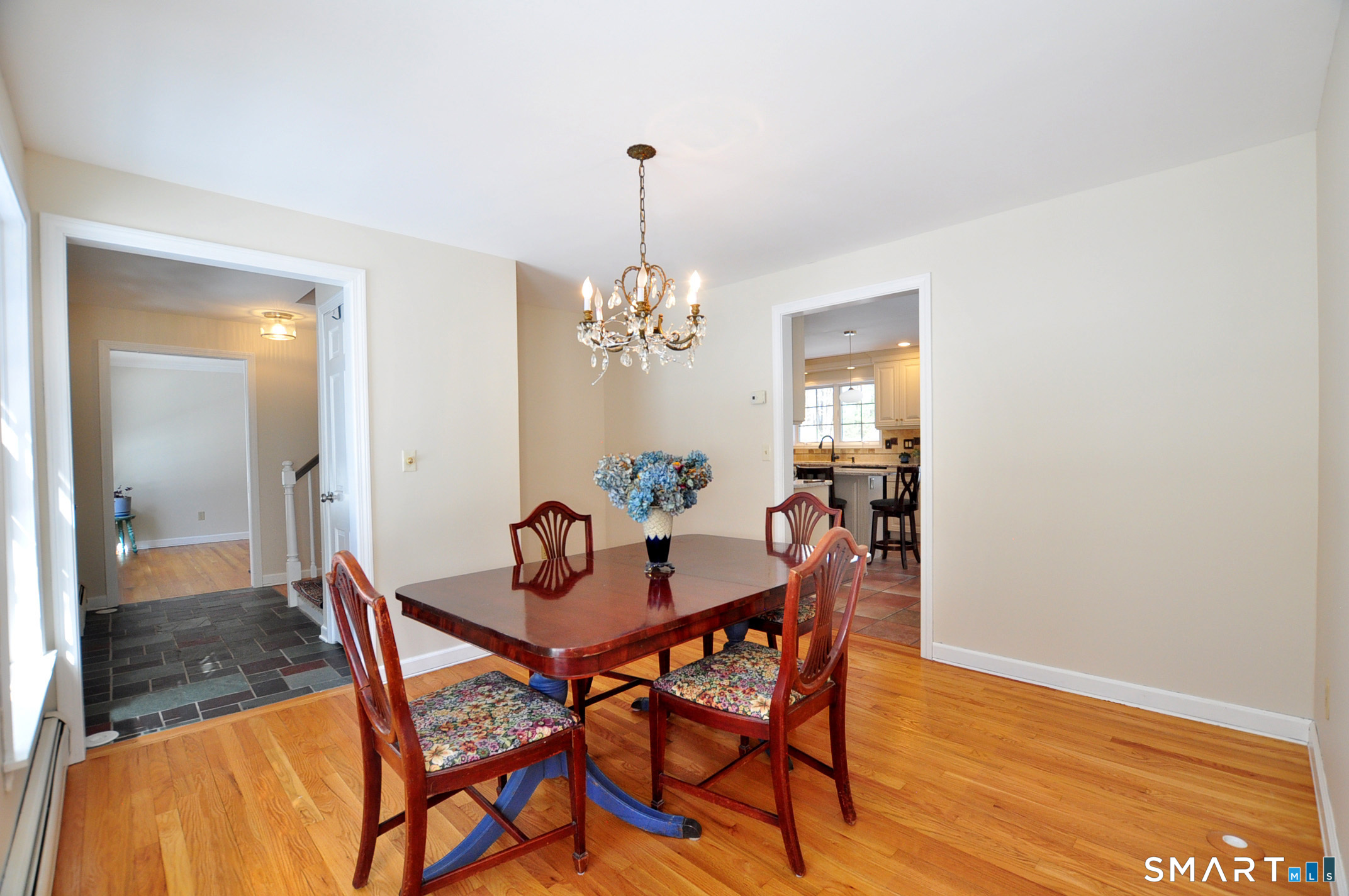 102 Petersen Road Granby, CT 06035 - Photo 16 of 40 a dining room with furniture and wooden floor