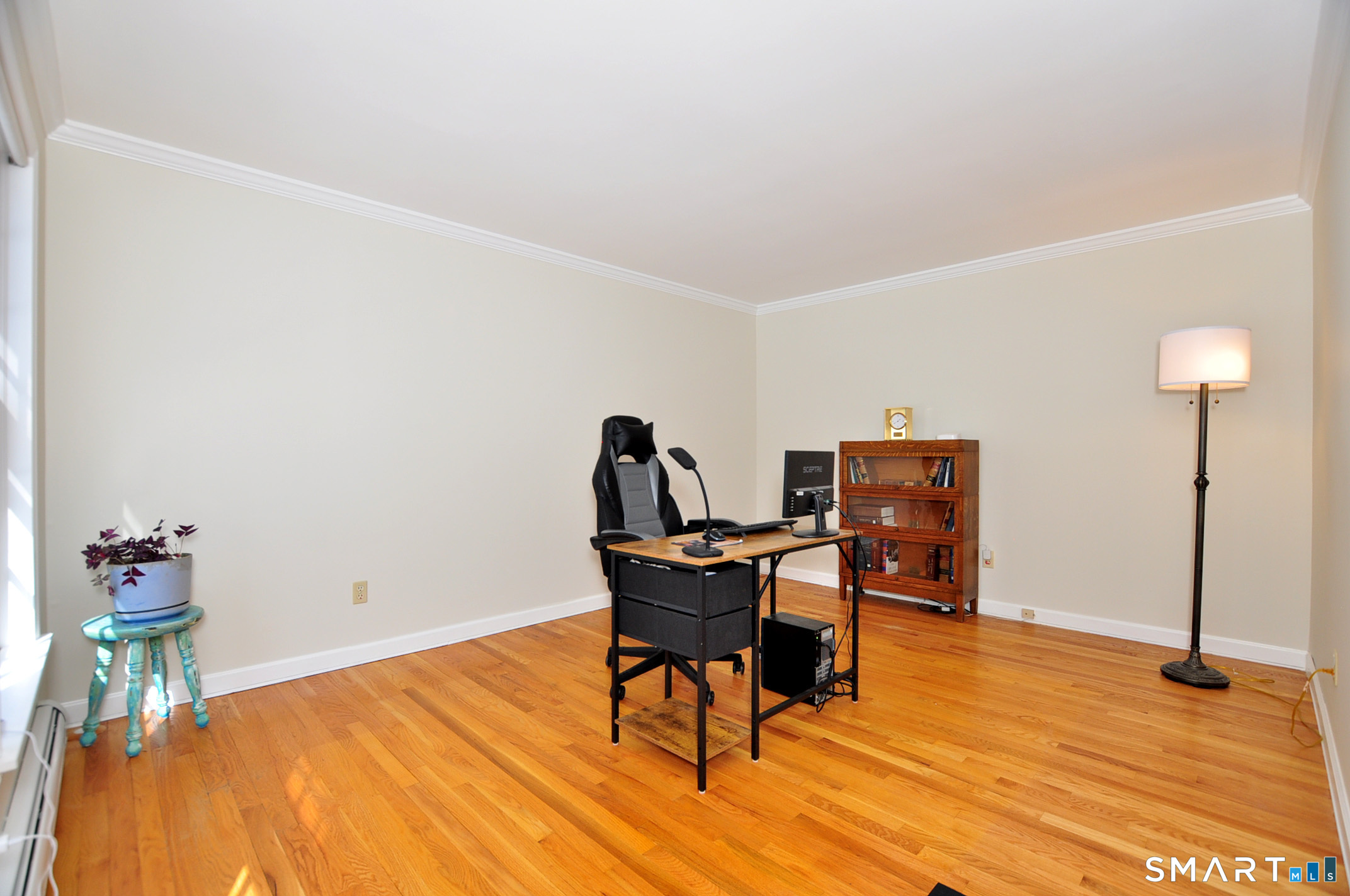 102 Petersen Road Granby, CT 06035 - Photo 19 of 40 a workspace with furniture and wooden floor